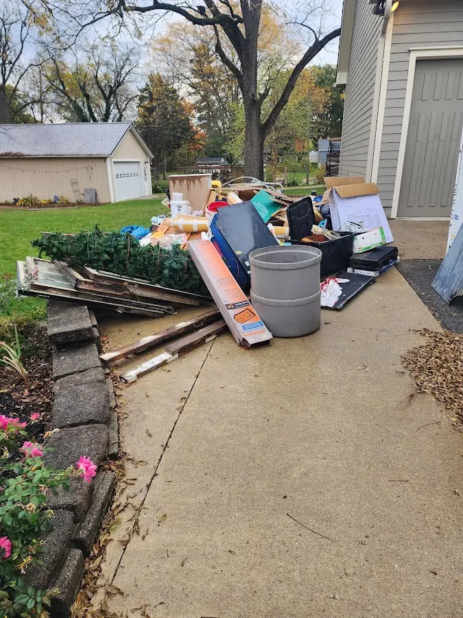 Dumpster being loaded with debris for Commercial Dumpster Rental in Mount Oliver